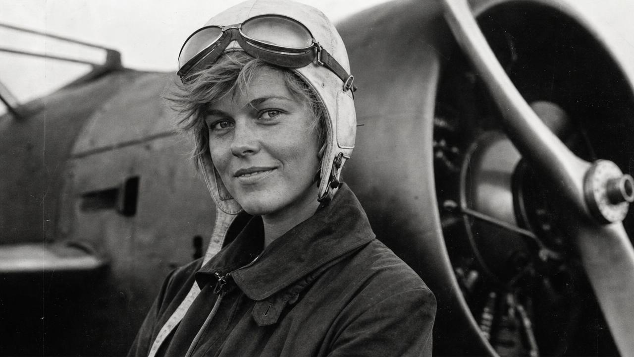 Pioneering aviator standing beside a vintage aircraft propeller